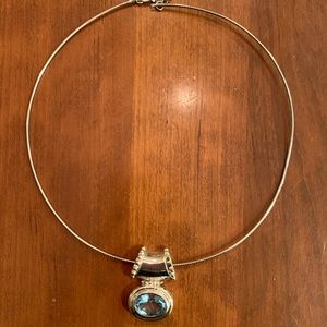 Aquamarine and silver pendant with chain.